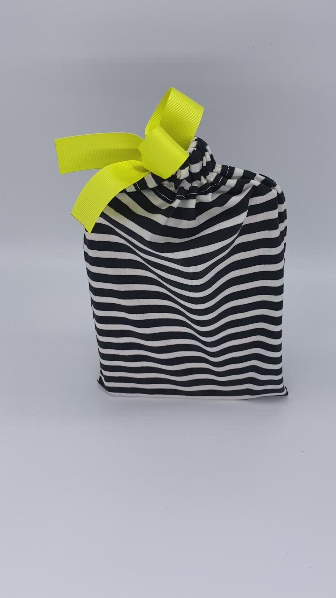 small black and white stripes reusable fabric gift bag with yellow ribbon